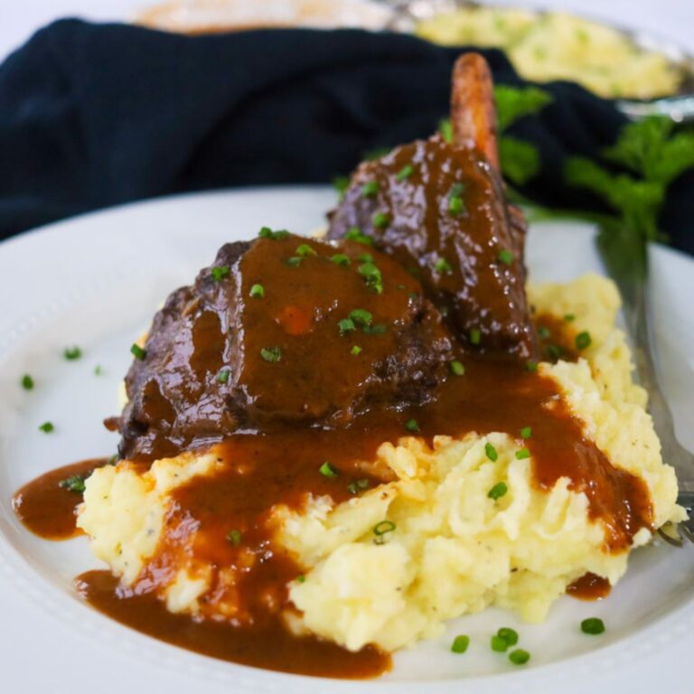 Red wine braised short ribs served over mashed potatoes with a red wine sauce on top.